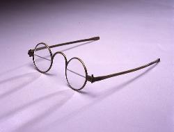 BiFocal Spectacles - The photo shows an old-fashioned bifocal pair of spectacles. It is typically called a 'Franklin-type' spects.