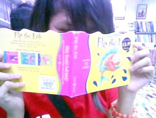read - a grown up girl reading a childrens book.. haha