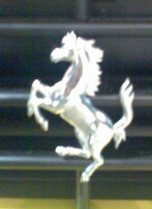 Ferrari Logo - A yellow ferrari horse logo