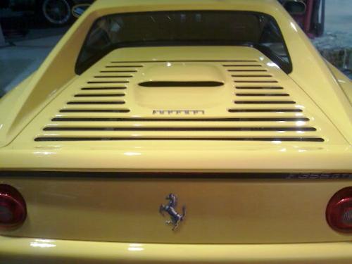 Ferrari - A back of a yellow Ferrari