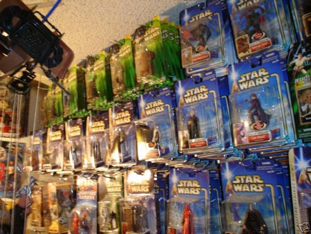 a collection of Star Wars figures - a large collection of boxed figures
