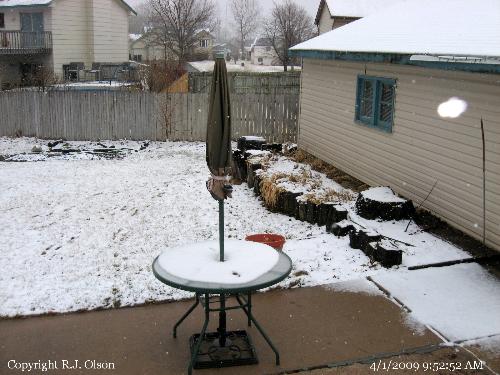 Snow covered Patio Table - April's first snow on my patio furniture. Snow covered Patio Table - April's first snow on my patio furniture.