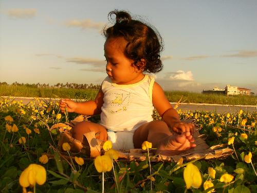 Innocence - The child in this picture is my second child. This was taken in one of our afternoon stroll at the subdivision partk at coastal bay. What struck me about this picture is the innocence of a child, their joy, being carefree. This remind us of our chilhood too.