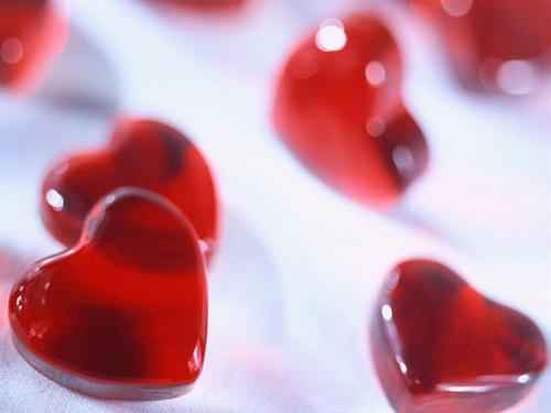 heart toffies - little heart toffies sweets sliding on a plain surface