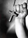 Child's faith - A child holding a cross