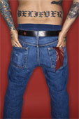 tatoo -  man- back view with tattoo reading believer.