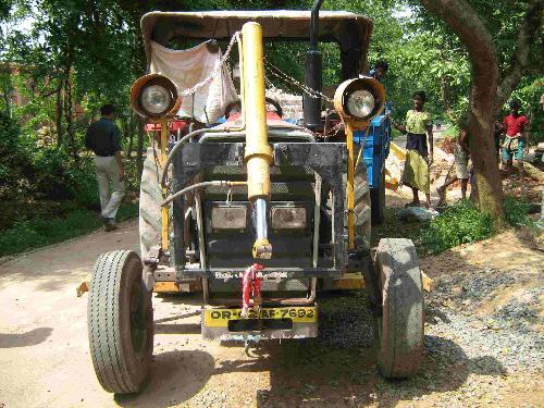 Tractor+dozer - a funny tractor which is a dozer.Looks funny with eyes and a nose.