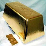 gold bar,money - The Mitsubishi Materials Corporation of Japan poured the World&#039;s largest Gold bar. The bar is 17.9 inches by 8.9 inches and 6.7 inches high. All though it takes up the same amount of space as a large shoe box, you would not be able to lift it as It weighs 551.15 pounds. At the time it was poured it was worth $3.7 million.
