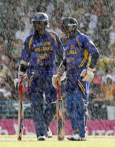 2007 Cricket Worldcup Finals! - Sanga and Jayasuriya having a chat as the rain pours down to make the run chase tough for the Sri Lankans!