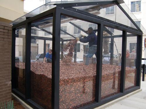 tons of penny - 50 Million pennies were added to this 'Memorial to the Missing'. It is suppose to represent the number of abortions since legalization in 1973. This enclosure weighs 156 tons and is worth a half million dollars. Pylons were driven into the foundation to support the bullet proof glass structure above.