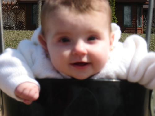 Grand daughter - Savanna loving the baby swing on Easter Sunday