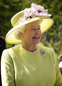 Politics and Governance - Elizabeth II (Elizabeth Alexandra Mary; born 21 April 1926) is the queen regnant of sixteen independent states known as the Commonwealth realms: the United Kingdom of Great Britain and Northern Ireland, Canada, Australia, New Zealand, Jamaica, Barbados, the Bahamas, Grenada, Papua New Guinea, the Solomon Islands, Tuvalu, Saint Lucia, Saint Vincent and the Grenadines, Belize, Antigua and Barbuda, and Saint Kitts and Nevis. All together, these countries have a combined population, including dependencies, of over 129 million. She holds each crown separately and equally in a shared monarchy, and carries out duties in and on behalf of all the states of which she is sovereign. She is also Head of the Commonwealth, Supreme Governor of the Church of England, Duke of Normandy, Lord of Mann, and Paramount Chief of Fiji. In theory her powers are vast; however, in practice, and in accordance with convention, she rarely intervenes in political matters.  Her long reign (57 years) has seen sweeping changes, including the dissolution of the British Empire (a process that began before her accession) and the consequent evolution of the modern Commonwealth of Nations. Elizabeth became Queen of the United Kingdom, Canada, Australia, New Zealand, South Africa, Pakistan, and Ceylon (now Sri Lanka) upon the death of her father, George VI, on 6 February 1952. As other British colonies gained independence from the United Kingdom, she became queen of several newly independent countries. During her 57 years on the throne, she has been the sovereign of 32 individual nations, but half of them subsequently became republics.  Elizabeth married Prince Philip, Duke of Edinburgh in 1947. The couple have four children and eight grandchildren. She is one of the longest-reigning British monarchs, after Victoria (who reigned over the United Kingdom for 63 years), George III (who reigned over Great Britain for 59 years), and James VI (who reigned over Scotland for over 57 years).