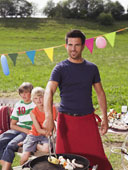 Barbecue - Father preparing barbecue, children in background
