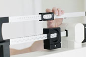 Scale - Woman Weighing Herself