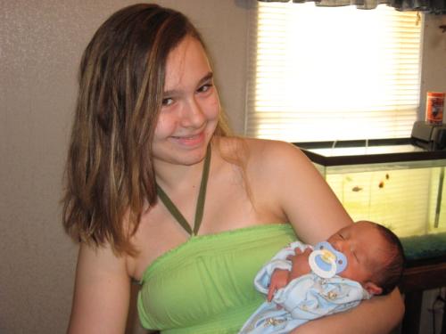 Harlie and Hayden - This is a pic of my oldest holding my youngest. What an age difference!!!