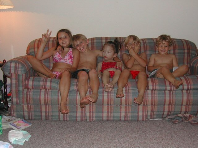 Summer party with cousins. - My daughter Chloe in the middle with red bikini bathing suit with white dots.  Around are her cousins who were ready to go to jump in the pool.  Everyone wanted to go for swim and Chloe wanted to take a nap.......