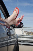 feet - Feet in car window with flip flops on