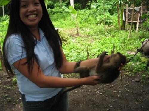 moymoy and me - It was taken when i was in Lemery, Batangas in my cousin's place I took a picture with moymoy (the name of the monkey) because its cute! and as i looked back and glance at this pic, i felt so sorry for this little creature since she was tied in the neck with rope..how sad isn't?