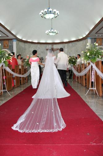 My Wedding March with my parents - This photo was taken during my wedding Last May 2007.
I was with my parents going to the altar. 
It was a wonderful and memorable moment for me.
I was so happy that day.