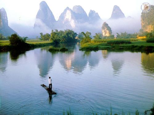 guilin water - it's not a painting. but a live photography of guilin. a chinese song said: guilin's water is the best all over the world, and lijiang's water is the best in guilin. here is not only the water, but the mountain, the tree. you may feel that the nature is more creative than any great painters, artists