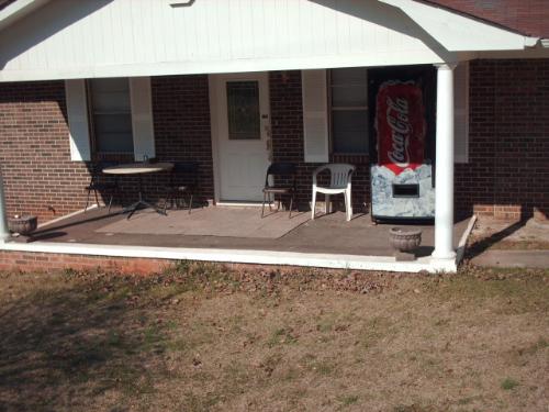 My Neighbors Home Business - A Coca Cola soda machine sitting on my neighbors front porch. Drawing traffic from the neighborhood children.