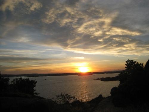 sunset - Overlooking at Lake Victoria, The biggest lake in the continent of Africa. A great view from the side and catching a good look while the sun sets. A lovely sight to end a long day.