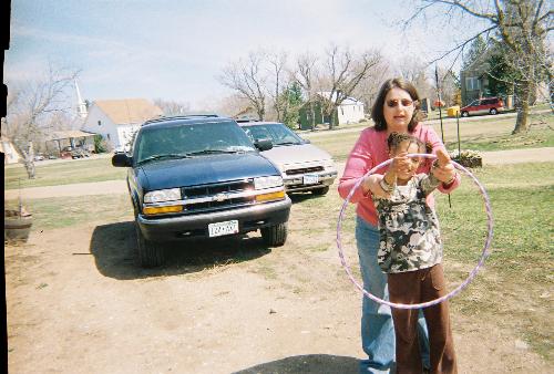 being a Aunt is great - My great niece and I. Trying to teach her how to switch arms with holla hoop.