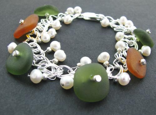 Ocean Treasures Sea Glass Bracelet - A 7' sterling silver bracelet is adorned with 6 pieces of sea glass 4 olive green and 2 amber brown. Tiny fresh water pearls accent the sea glass perfectly. A wonderful earthy accessory for the sea glass/beach lover...