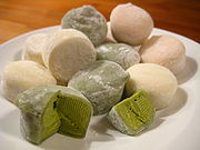 Ice Cream - Mochi ice cream is a Japanese confection made from mochi (pulverized sticky rice) with an ice cream filling.  Originally created by Lotte, as Yukimi Daifuku in 1981. Lotte first made the product by using a rice starch instead of sticky rice and a type of ice milk instead of real ice cream Mochi ice cream is now an internationally recognized food. Current marketing names include Mikawaya's 'Mochi Ice Cream' in the United States (also utilized by other companies), which began production of what is now known as mochi ice cream in the United States in 1993.  Mochi ice cream is a round finger food varying in diameter, but comparable to a golf ball in size, shape and weight: 45 g mass and 45 mm diameter. For comparison, Mikawaya's brand of mochi ice cream is approximately 42.5 grams in mass.  There are two layers: a soft, dough-like outer mochi shell, and inner ice cream core.  Flavors are dependent on brand, however, matcha (ground green tea), chocolate, and vanilla are likely to be represented (flavors of both Mikawaya and Lotte brand mochi ice creams). Strawberry, mango, and red bean paste (anko) are also common flavors.