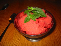 Sorbet Galore - Sorbet (pronounced/s?r'be?/ sor-bay) is a frozen dessert made from sweetened water flavoured with iced fruit (typically juice or puree), chocolate, wine, and/or liqueur. The origins of sorbet have explained being either a Roman invention, a Chinese invention brought back by Marco Polo or from a Middle Eastern drink charbet, made of sweetened fruit juice and water. The term'sherbet'/'charbet' is derived from Turkish: serbat/serbet,'sorbet', which in turn comes from the Arabic ????? sharbat meaning'drink(s)' or'juice.'