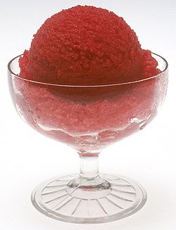 Sorbet Galore - Sorbet is often confused with water ice, Italian ice, and sherbet.  The word 'Sorbet' (pronounced /s?r'be?/, /'s?rb?t/, or /s?r'b?t/) is French (French pronunciation: [s??'b?]) for the Ottoman Turkish word 'Sherbet'.Sorbets/sherbets may also contain alcohol, which lowers the freezing temperature, resulting in a softer texture. In North America, sherbet is often mis-spelled sherbert.  Whereas ice cream has air whipped into it, sorbet has almost none, which makes for a dense and extremely flavourful product. Both sorbet and frozen yogurt are served as non-fat or low-fat (sometimes 3% fat) alternatives to ice cream.  In Italy a virtually identical dish called granita is made, which is only really different from sorbet in that it has a crunchier texture because of the freezing process. As the liquid freezes, it forms noticeably large-size crystals, which should not be present in sorbet because of the stirring. Granita is also often sharded with a fork to give an even crunchier texture when served.  Agraz is a type of sorbet, usually associated with the Maghreb and north Africa. It is made from almonds, verjuice, and sugar. It has a strongly acidic flavour, because of the verjuice.