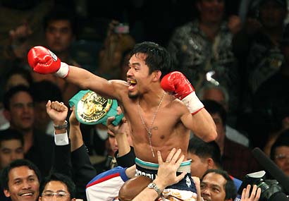 Victorious - Manny Pacquiao wins. KOs Ricky Hatton at Round 2.