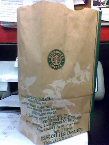 paper bag - the starbucks is an eco friendly store and an advocate in saving our earth. they even have paper bags and tray for the to go treats. the paper bag like the tissues has writing about information on how to save mother other. like 'less tissue more tree'. and how wonderful to live in green earth. enjoy your starbucks..