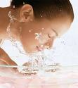 Skincare - This photo shows a lady washing her face to purification. Skincare is an essential part of our daily care.
