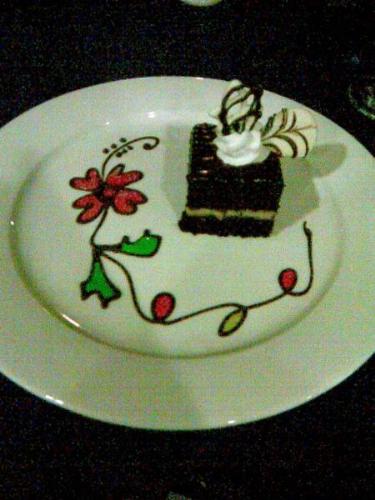 chocolate cake - a slice of chocolate cake with icing decors