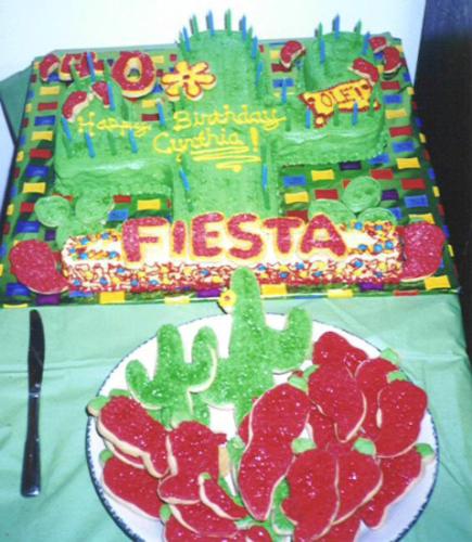 woo-hoo a fiesta! - A fiesta cake is great for birthdays, cinco de mayo or whenever you want to have a party! Use a sheet/rectangular cake pan; remove cooked cake from pan. Cut into a cactus shape.Frost cake and use broken chow mein noodles to look like thorns on the cactus. Decorate with cut-out cookies like chili peppers.