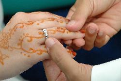 wedding ritual - the bridegroom slids our wedding ring on to me