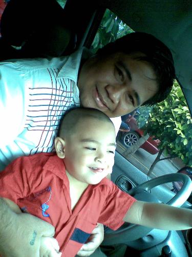 daddy - this is a picture of a dad holding his only son.
