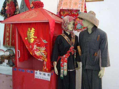 Traditional Hong Kong People - A look of Traditional Hong Kong People in a museum in Tai O of Hong Kong, the clothes and transportation tools are very interesting indeed