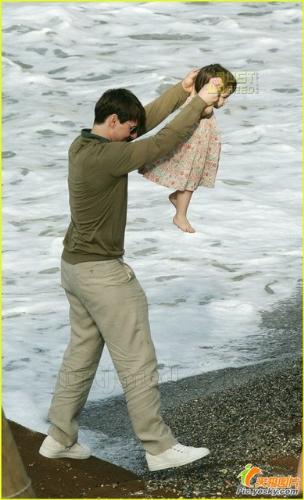 Sweetie Dady - This is a sweet dady with his daughter who is so small in her father hand on the rocks along the sea.