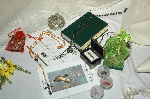 wedding pharaphernalia - Bible, cord, rosary, coins & misalette. This are use in a catholic wedding.