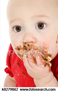 baby eating - a baby eating with a cake