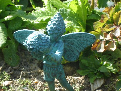 Green Faerie With Cone - My favourite garden ornament is this green faerie holding a cone.