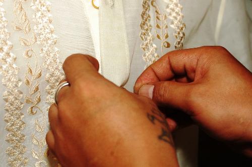Barong Tagalog - Buttoning of the Barong Tagalog by the best man