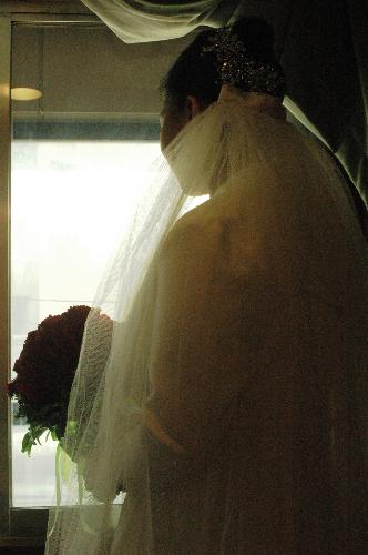 Waiting for call time - The bride waiting for her time to go down the aisle