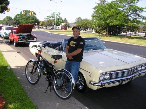 My good friend Mark and his 'baby'-check it out! - My friend Mark--loves his car!!! He has had this car for at least 15 years and it runs like a champ!Looks beautiful!The bike you see is actually motorized,or you can just peddle it.Any of you have cars you collect-baby or love?