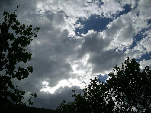 Sun Peaking thru the clouds - I took this picture in my backyard. The sun is peaking thru the clouds
