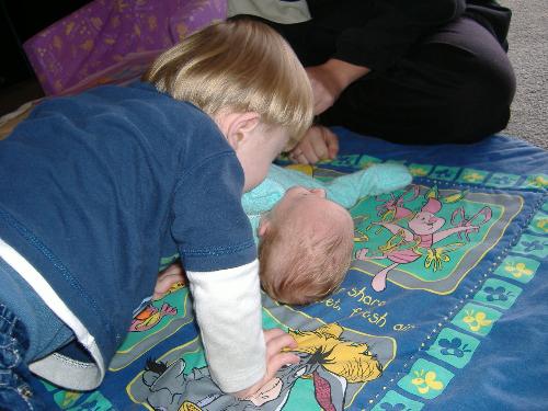 ben - Ben giving his newborn cousin a kiss