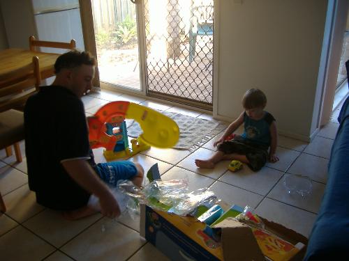 Ben third b.day - Ben and dad building his new car set