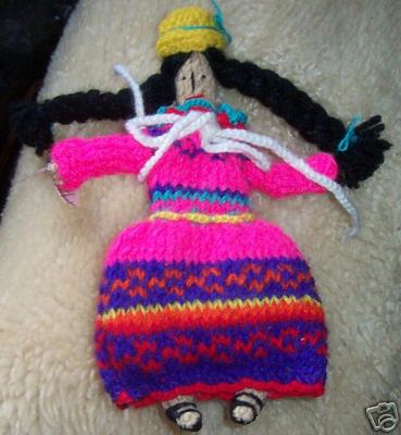 Bolivian knitted doll - How cute is this little doll with her bowler hat from Bolivia.